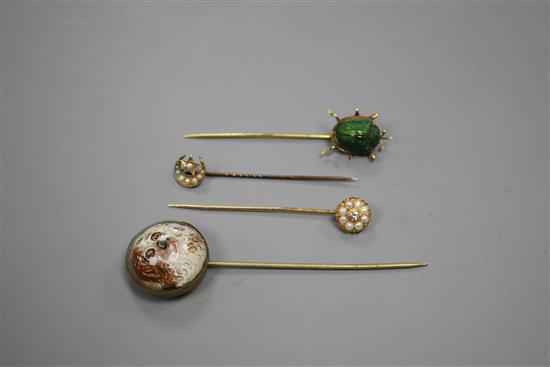 A yellow metal and scarab set stick, three others including Essex crystal style, pearl and pearl and diamond, largest 82mm.